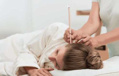 Calming ear candling wellness treatment at Massage by Laura, Runaway Bay